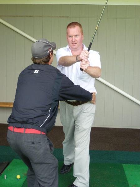 Paul Smart having golf lessons